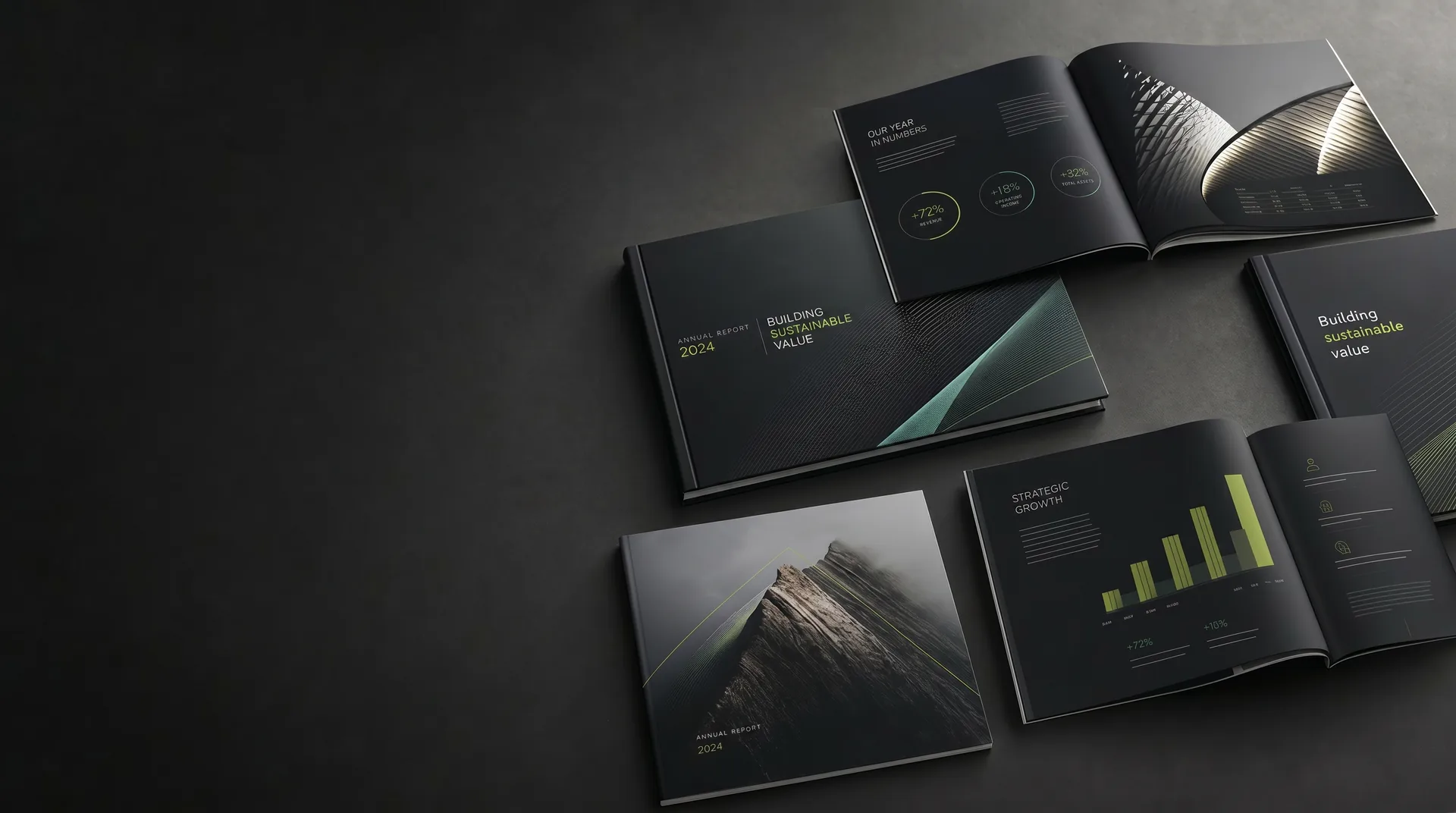 Premium annual report designs and layouts arranged on a dark studio surface