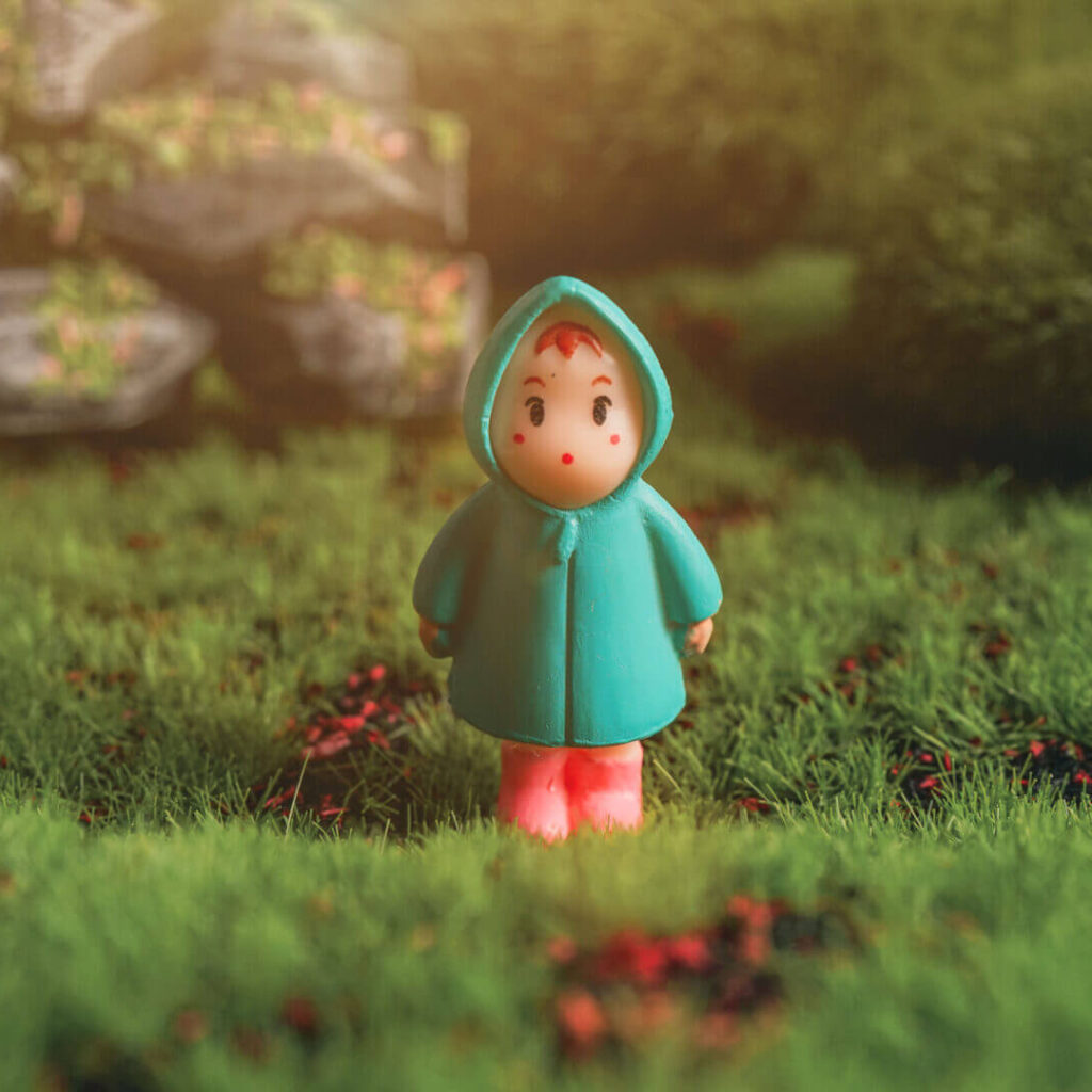A Doll Standing in The Field of Animation Studios in Singapore